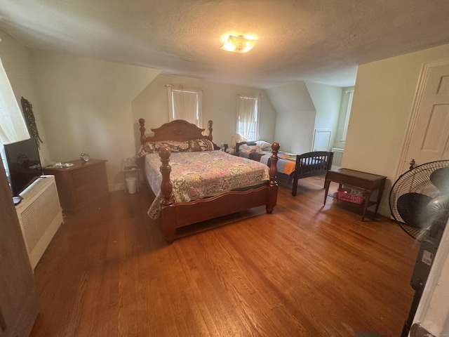 34 Knollwood Rd, East Hartford, CT 06118 - bedroom featuring wood finished floors, a textured ceiling, and radiator
