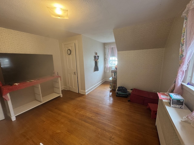 34 Knollwood Rd, East Hartford, CT 06118 - additional living space featuring wallpapered walls and wood finished floors
