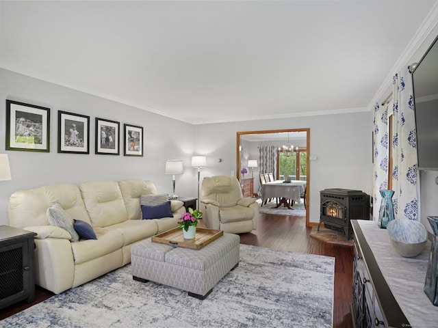 95 Pepperidge Cir, Stratford, CT 06614 - living room with ornamental molding, wood finished floors, a notable chandelier, and a wood stove