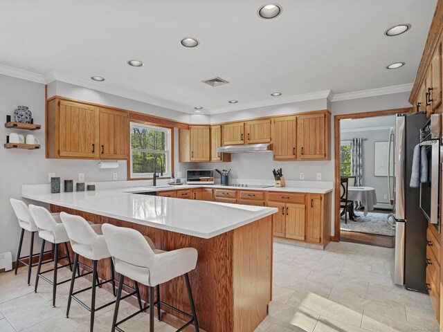 95 Pepperidge Cir, Stratford, CT 06614 - kitchen with freestanding refrigerator, a peninsula, recessed lighting, a kitchen bar, and visible vents
