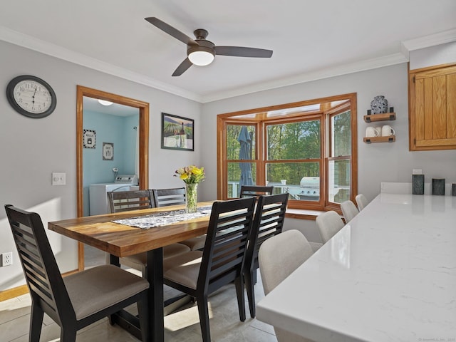 95 Pepperidge Cir, Stratford, CT 06614 - dining space featuring washing machine and clothes dryer, ceiling fan, crown molding, and light tile patterned floors