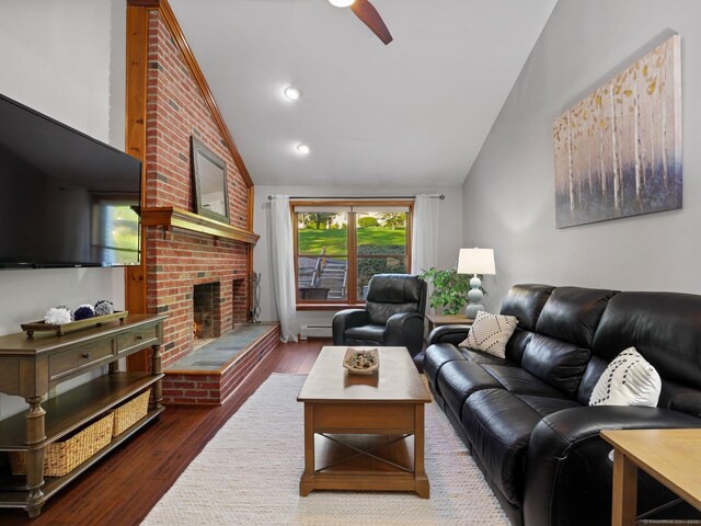 95 Pepperidge Cir, Stratford, CT 06614 - living area featuring wood finished floors, lofted ceiling, a fireplace, ceiling fan, and baseboard heating