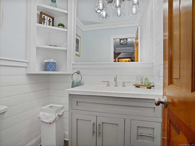 95 Pepperidge Cir, Stratford, CT 06614 - half bathroom with vanity, ornamental molding, and toilet