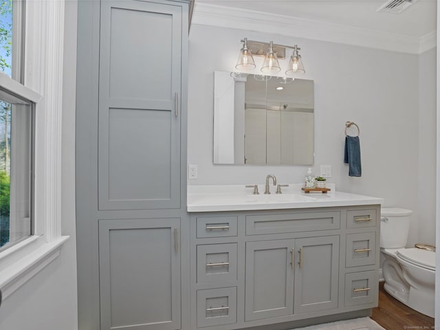 95 Pepperidge Cir, Stratford, CT 06614 - full bathroom featuring crown molding, vanity, toilet, wood finished floors, and visible vents