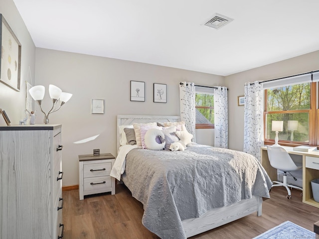 95 Pepperidge Cir, Stratford, CT 06614 - bedroom featuring baseboards, wood finished floors, and visible vents