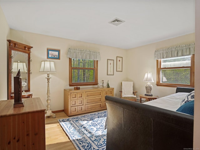 95 Pepperidge Cir, Stratford, CT 06614 - bedroom with baseboards, multiple windows, light wood-type flooring, and visible vents