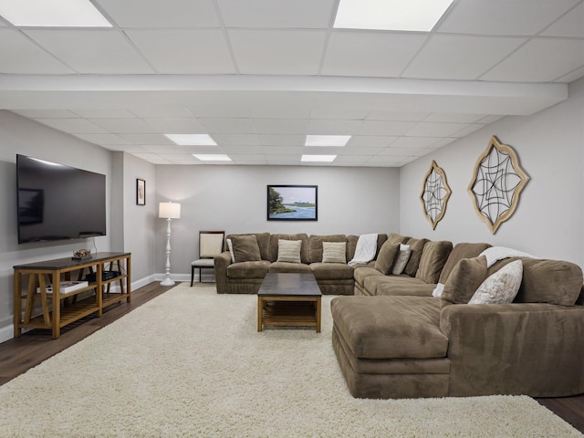 95 Pepperidge Cir, Stratford, CT 06614 - living room featuring baseboards, a drop ceiling, and dark wood-type flooring