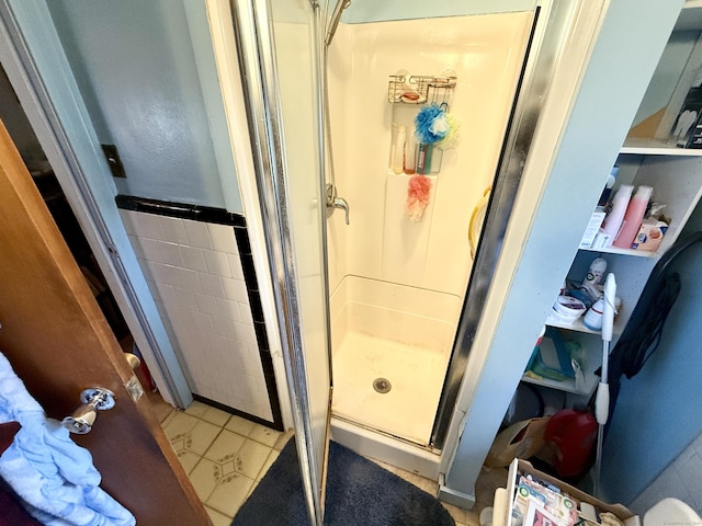 bathroom featuring a shower stall