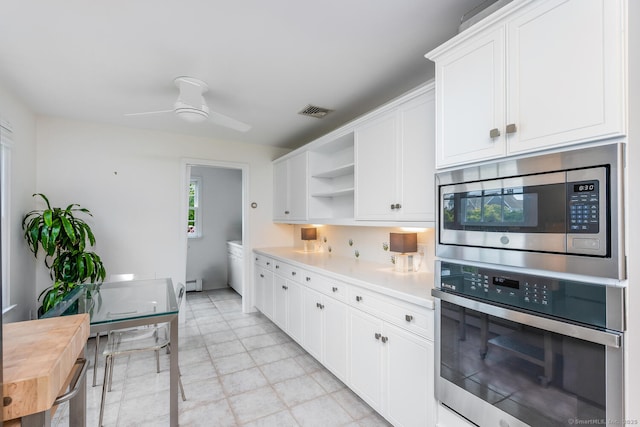 kitchen with visible vents, open shelves, light countertops, stainless steel appliances, and white cabinetry