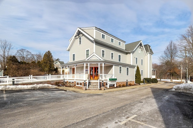 27 Catoonah St, Ridgefield, CT 06877 - view of front of house with fence and a porch