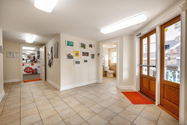27 Catoonah St, Ridgefield, CT 06877 - foyer featuring light tile patterned floors and baseboards