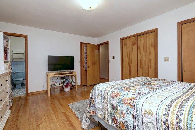 478 Alpom Dr, Orange, CT 06477 - bedroom with light wood-style flooring, multiple closets, and connected bathroom