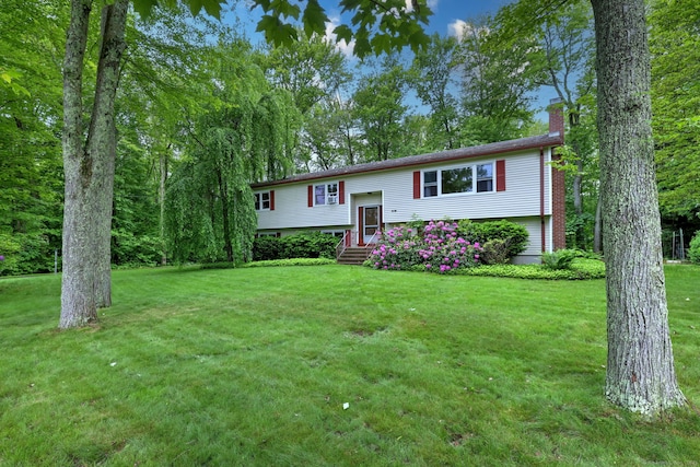 478 Alpom Dr, Orange, CT 06477 - bi-level home with a chimney and a front lawn