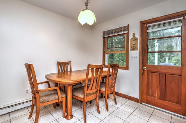 478 Alpom Dr, Orange, CT 06477 - dining area with a baseboard radiator, light tile patterned flooring, and baseboards