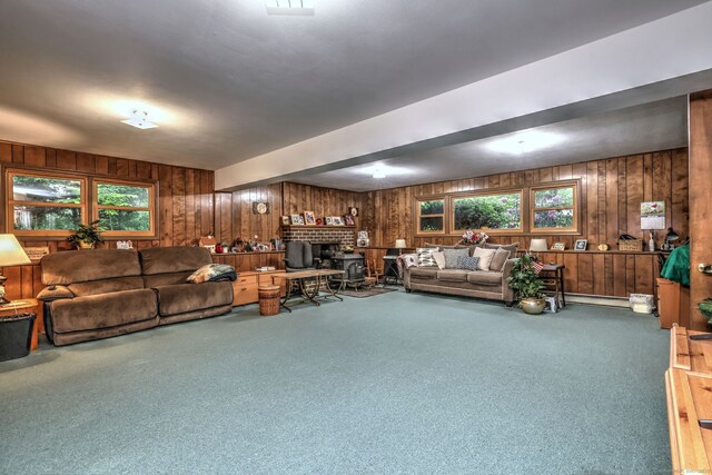 478 Alpom Dr, Orange, CT 06477 - carpeted living area with wood walls and plenty of natural light