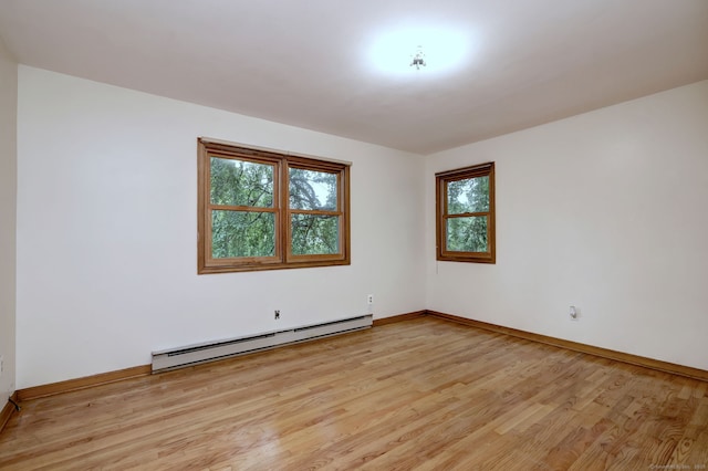 478 Alpom Dr, Orange, CT 06477 - empty room with a baseboard radiator, plenty of natural light, light wood-style flooring, and baseboards