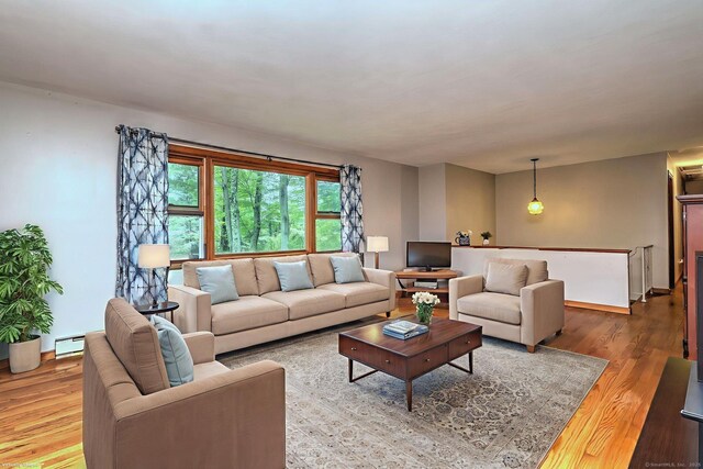 478 Alpom Dr, Orange, CT 06477 - living room featuring wood finished floors and a baseboard heating unit