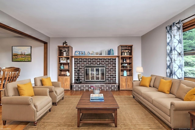 478 Alpom Dr, Orange, CT 06477 - living room featuring wood finished floors and a brick fireplace