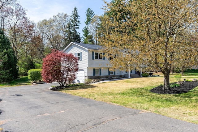 101 Michele Dr, Somers, CT 06071 - view of front of property with an attached garage, driveway, and a front lawn