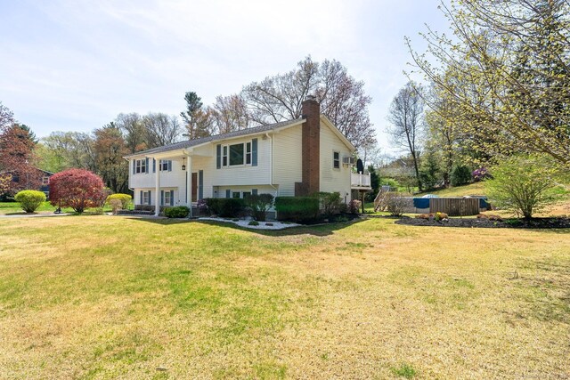 101 Michele Dr, Somers, CT 06071 - bi-level home featuring a chimney and a front lawn