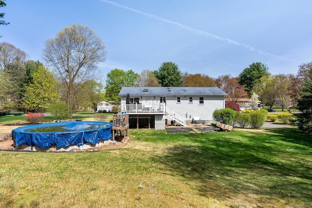 101 Michele Dr, Somers, CT 06071 - rear view of property featuring a lawn, stairs, a covered pool, and a deck