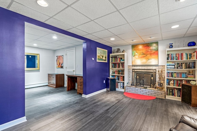 101 Michele Dr, Somers, CT 06071 - living area with baseboards, a baseboard heating unit, a fireplace, and wood finished floors