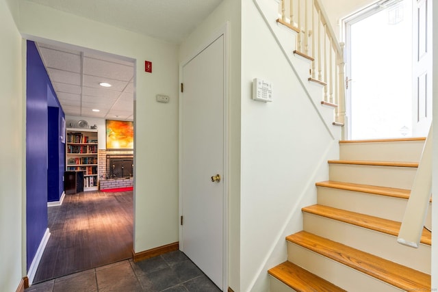 101 Michele Dr, Somers, CT 06071 - staircase with recessed lighting, baseboards, tile patterned floors, and a fireplace