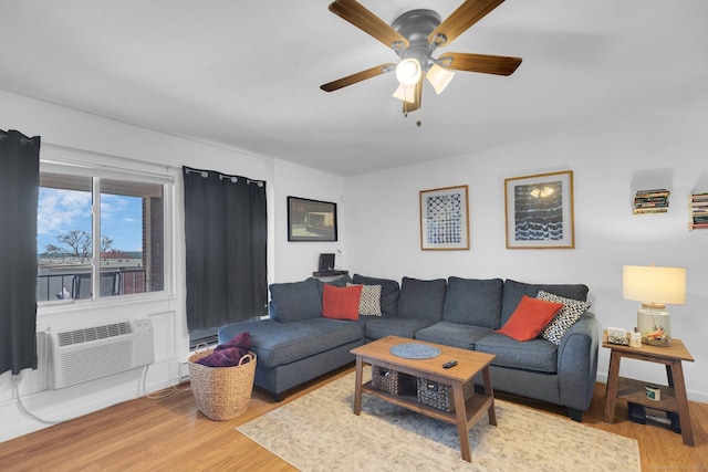 257 W Walk Unit 257, West Haven, CT 06516 - living area with a wall unit AC, a ceiling fan, and wood finished floors