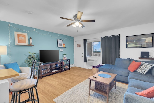 257 W Walk Unit 257, West Haven, CT 06516 - living area featuring an AC wall unit, a ceiling fan, baseboards, and wood finished floors