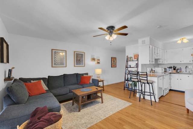 257 W Walk Unit 257, West Haven, CT 06516 - living area with light wood-style floors and a ceiling fan
