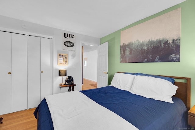 257 W Walk Unit 257, West Haven, CT 06516 - bedroom with light wood-style floors and a closet