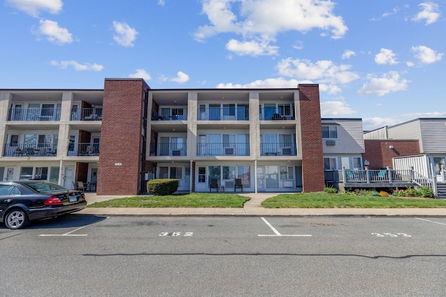 257 W Walk Unit 257, West Haven, CT 06516 - view of building exterior featuring uncovered parking