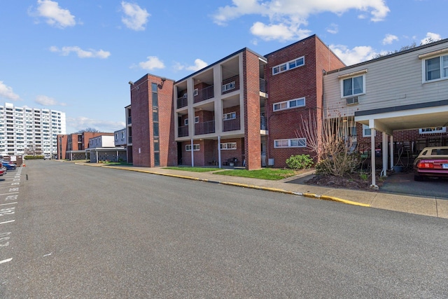 257 W Walk Unit 257, West Haven, CT 06516 - view of building exterior featuring uncovered parking