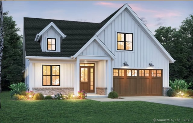 modern inspired farmhouse with board and batten siding, brick siding, a front lawn, concrete driveway, and an attached garage