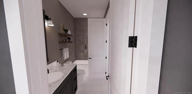 bathroom with vanity, tile patterned floors, and toilet