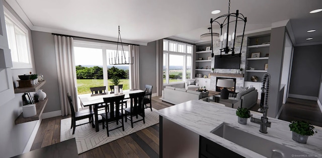 dining area with baseboards, dark wood-style floors, and a chandelier