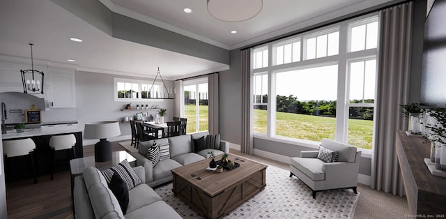 living room featuring an inviting chandelier, baseboards, ornamental molding, and recessed lighting