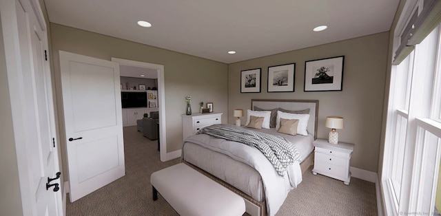 bedroom with recessed lighting, baseboards, and light carpet