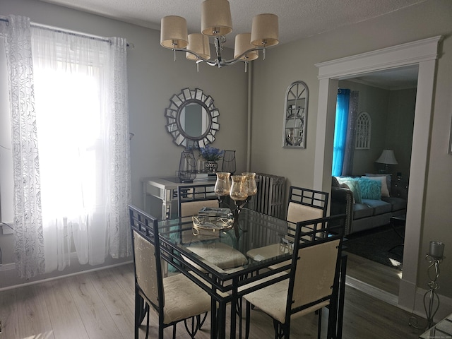 dining area featuring an inviting chandelier and light wood-style floors