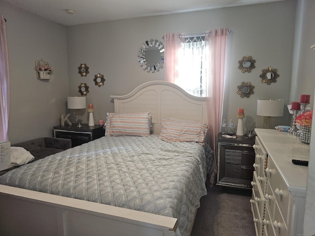 bedroom featuring dark colored carpet