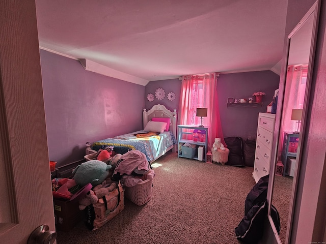 bedroom featuring carpet floors and vaulted ceiling