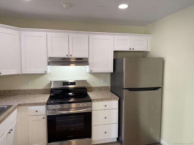 kitchen featuring appliances with stainless steel finishes, light countertops, under cabinet range hood, recessed lighting, and white cabinetry