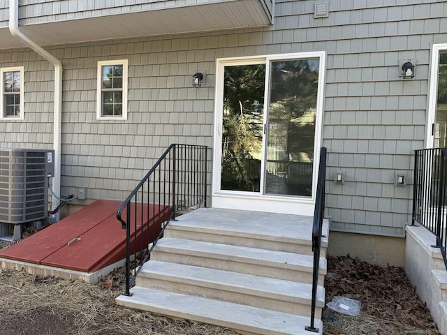 doorway to property featuring cooling unit