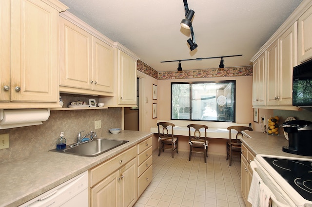 701 Heritage Vlg Unit B, Southbury, CT 06488 - kitchen with white appliances, light tile patterned floors, light countertops, rail lighting, and decorative backsplash