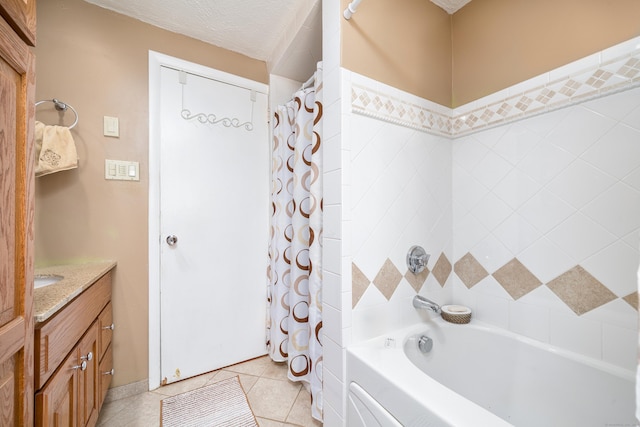 full bathroom featuring vanity, tile patterned flooring, and shower / tub combo
