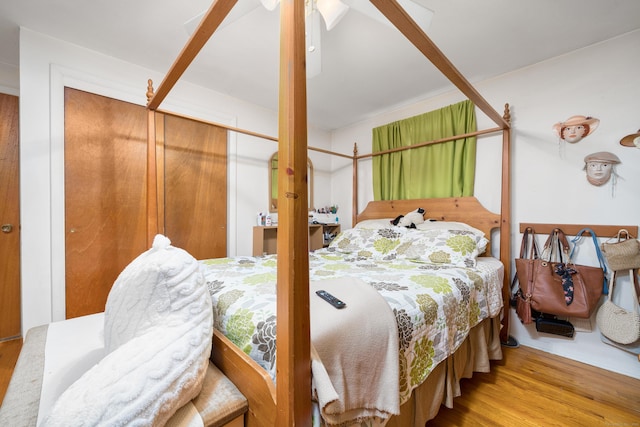bedroom with wood finished floors