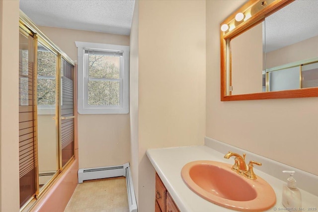 bathroom featuring vanity, baseboard heating, a textured ceiling, a baseboard heating unit, and combined bath / shower with glass door