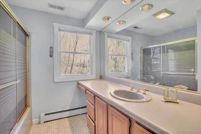 bathroom with visible vents, baseboards, a baseboard radiator, vanity, and recessed lighting