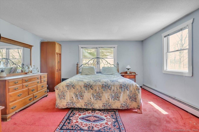 bedroom with a baseboard radiator, a textured ceiling, and light carpet