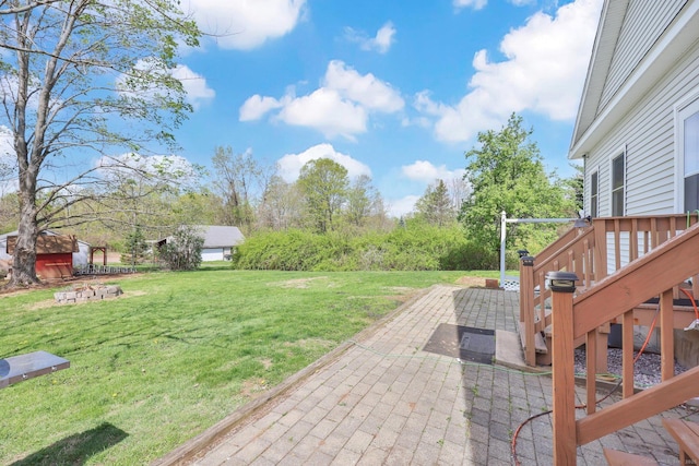 view of yard with a patio area and a deck